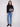 Elegant black sweater highlighted by a crew neck and detailed floral jacquard pattern for a chic look by Charlie B.