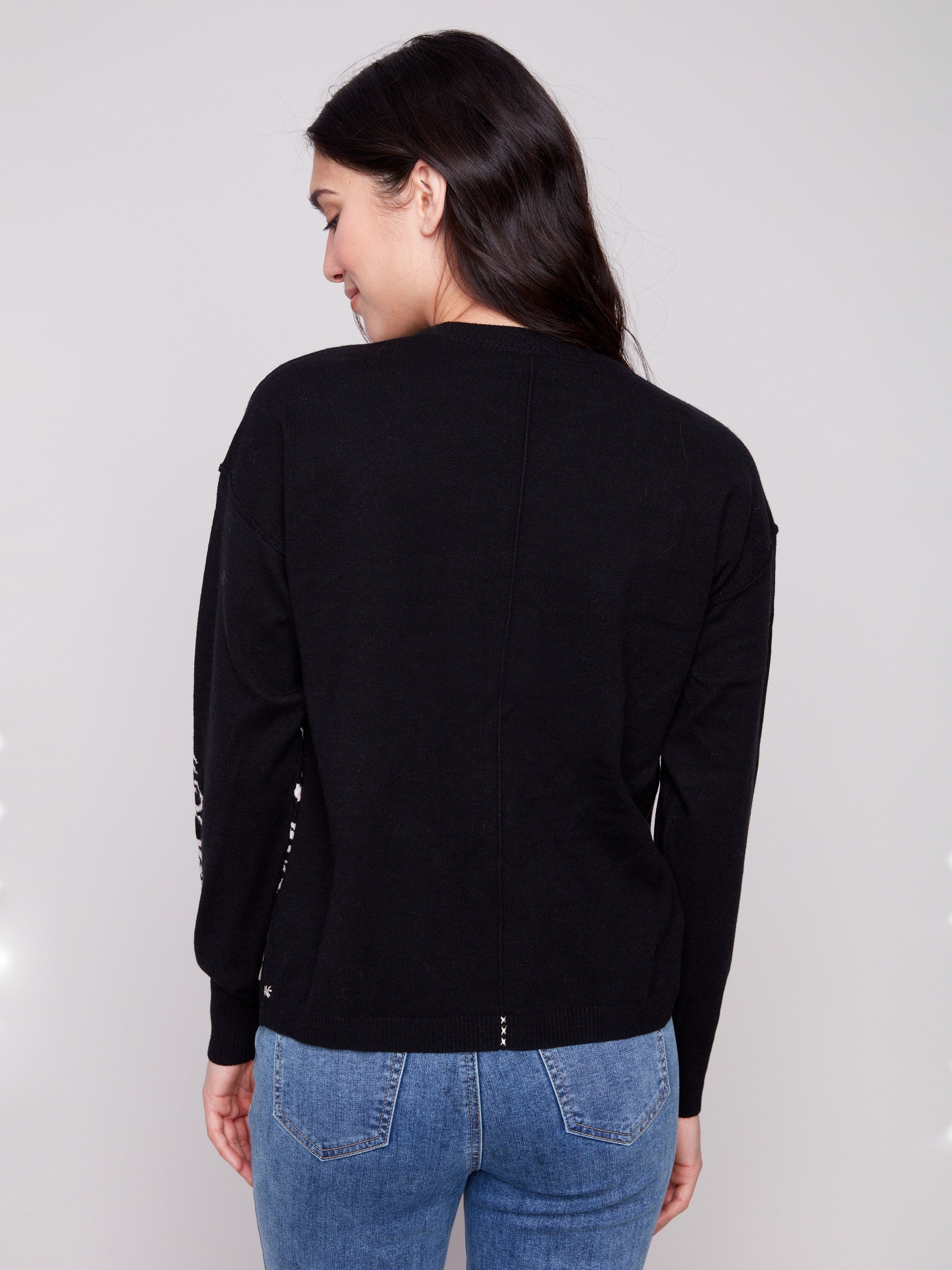 Chic black sweater in a relaxed fit, adorned with an exquisite jacquard floral pattern on the sleeves by Charlie B.