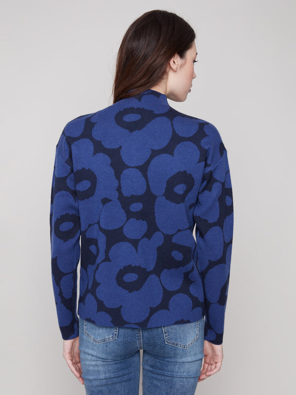 Charming jacquard sweater in blue with a cozy mock neck and artistic floral design by Charlie B.