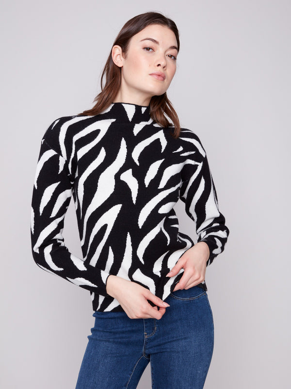 Zebra-patterned jacquard sweater with a slim fit, showcasing bold black and white design. Perfect for stylish layering by Charlie B.
