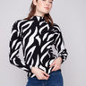 Zebra-patterned jacquard sweater with a slim fit, showcasing bold black and white design. Perfect for stylish layering by Charlie B.