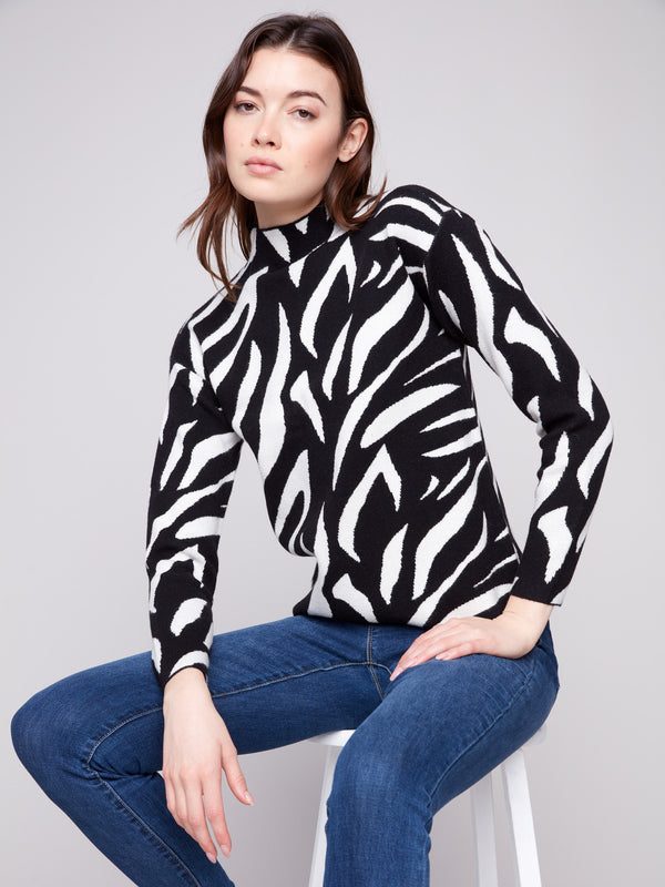 Elegant sweater with a mock neck and striking zebra pattern, offering both comfort and style in one piece by Charlie B.