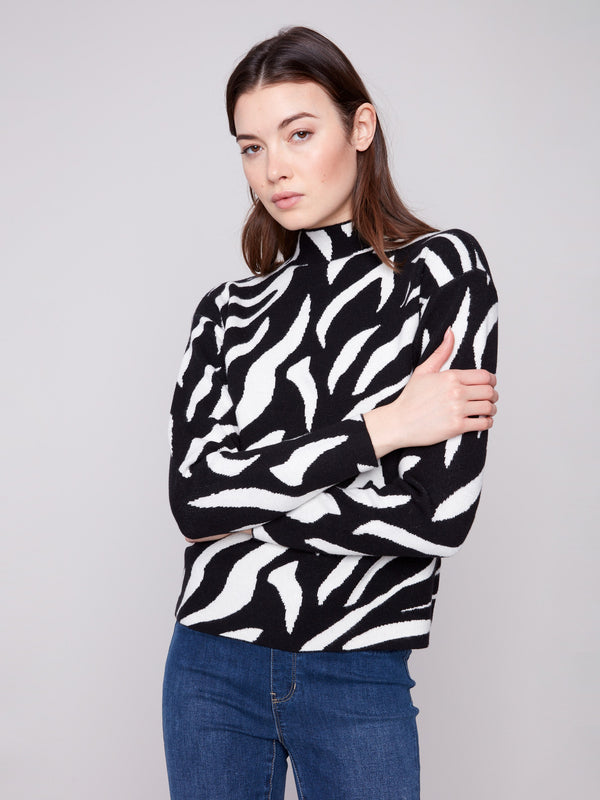Sophisticated zebra-patterned top designed with a mock neck, enhancing any outfit effortlessly by Charlie B.
