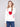 White plush knit sweater with a ribbed hem, showcasing red and black graphics by Charlie B.
