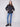Fashionable black puffer jacket with practical welt pockets and a modern look by Charlie B.