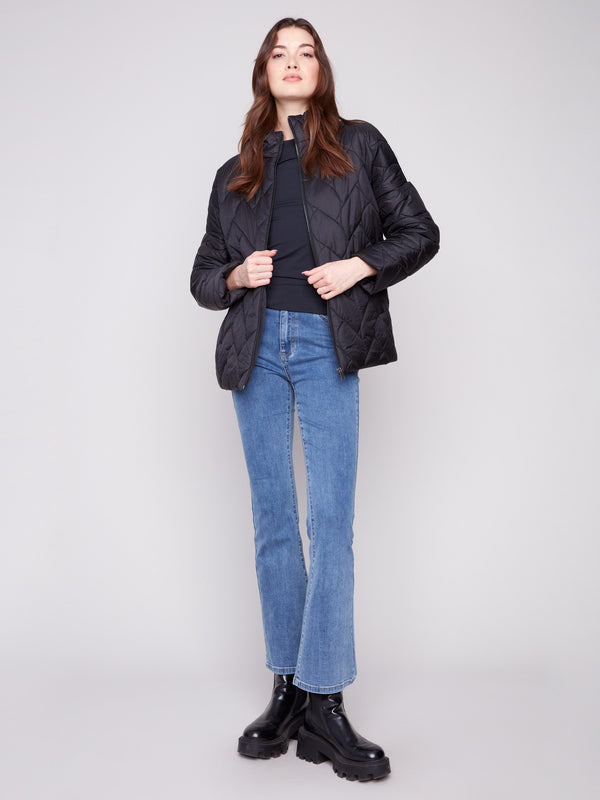 Trendy black puffer jacket showcasing both functionality and elegance in its design by Charlie B.