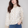 Ecru jacquard sweater showcasing a relaxed fit with geometric patterns, perfect for casual elegance by Charlie B.