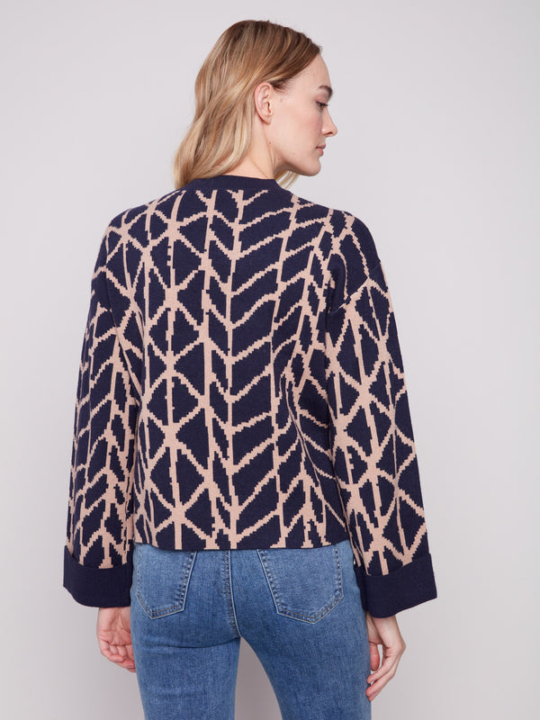Elegant navy blue sweater in jacquard pattern with crew neckline, offering a comfortable and chic appearance by Charlie B.