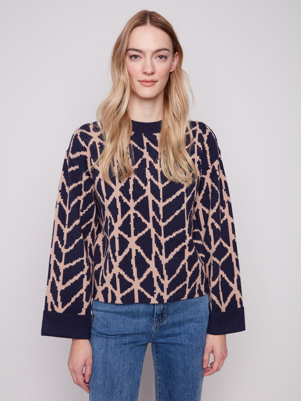 Navy blue sweater with geometric jacquard pattern, highlighting its relaxed fit for ultimate comfort by Charlie B.