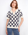 Navy and cream crochet top with a standout Johnny collar, highlighted by its intricate design pattern by Charlie B.