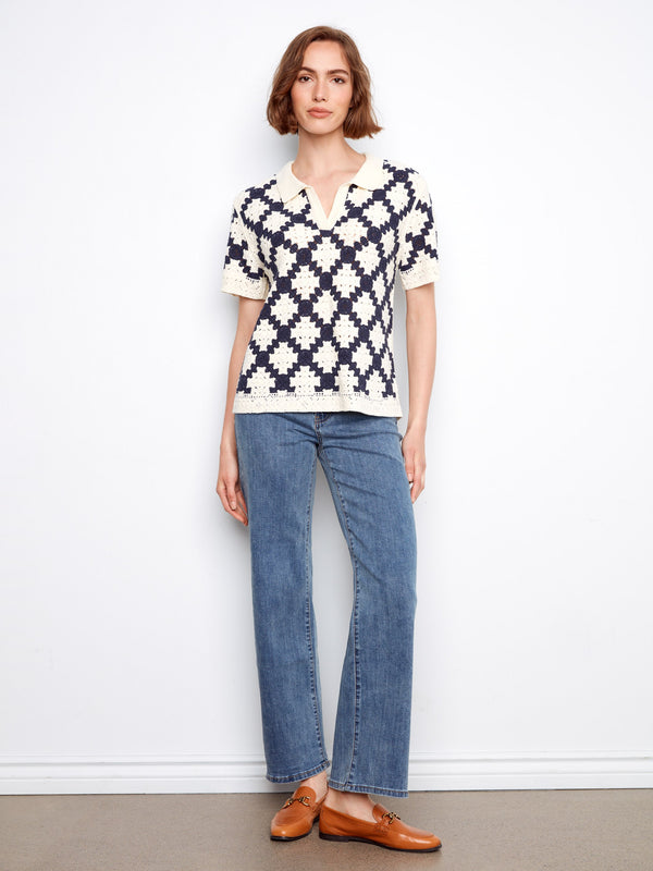 Geometric pattern crochet top in navy and cream, featuring elegant short sleeves for a chic look by Charlie B.