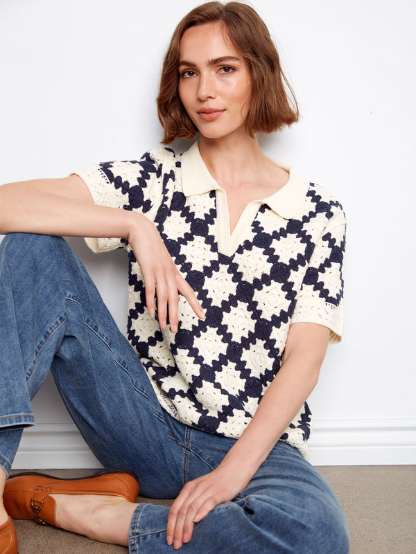 This stylish navy and cream crochet top showcases a beautiful Johnny collar with its unique design by Charlie B.