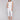 White knee-high capri pants featuring a regular rise by Charlie B.