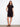 Chic knee-length dress in black, featuring convenient side pockets ideal for daily wear by Charlie B.
