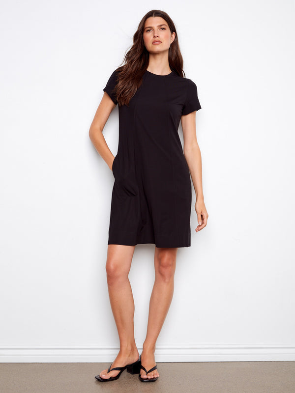 Chic knee-length dress in black, featuring convenient side pockets ideal for daily wear by Charlie B.