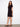 Sophisticated black dress designed with a stylish crew neckline and comfortable fit by Charlie B.