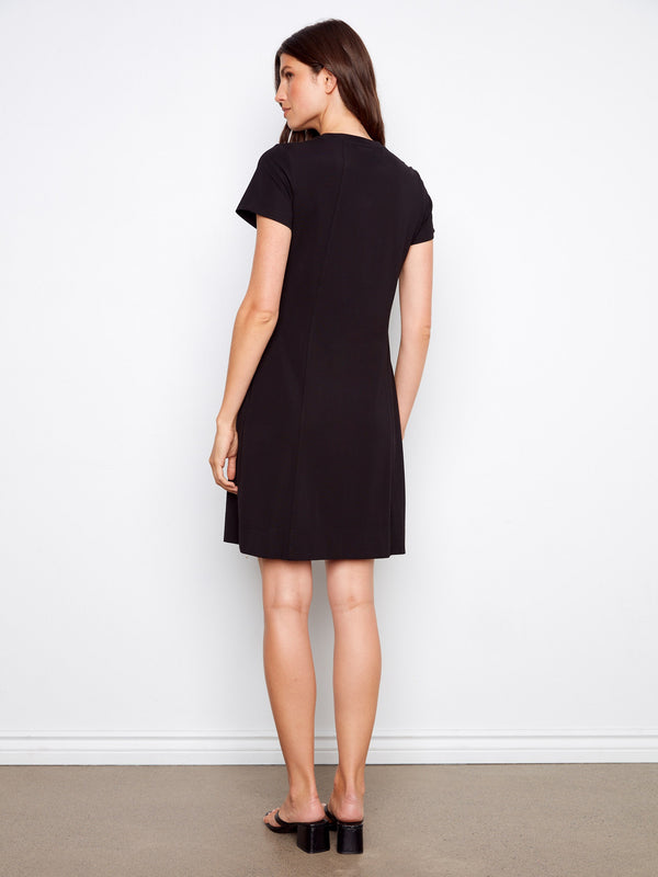 Timeless black dress crafted with attention to detail, including a refined crew neckline by Charlie B.
