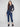Indigo denim jogger pants featuring a slim leg and elastic waistband, paired with rolled cuffs for a chic look by Charlie B.