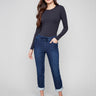 Indigo denim jogger pants featuring a slim leg and elastic waistband, paired with rolled cuffs for a chic look by Charlie B.