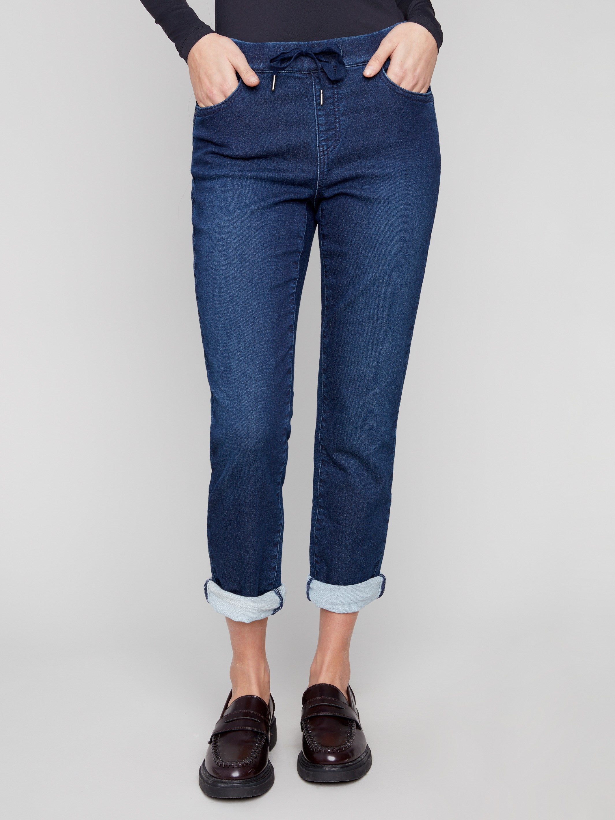 Comfortable indigo denim jogger pants with a mid-rise waist and stylish rolled cuffs, perfect for casual outings by Charlie B.