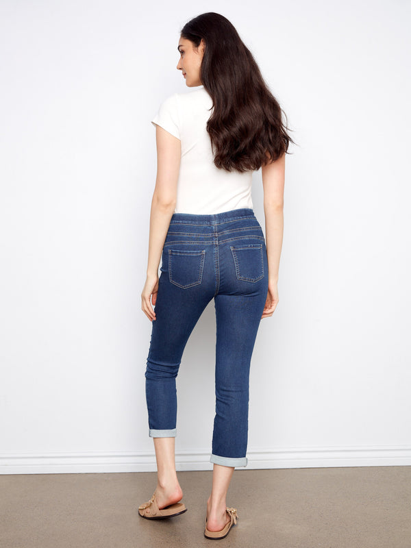 Indigo knit denim jogger pants designed with an elastic waistband and drawstring for adjustable comfort by Charlie B.