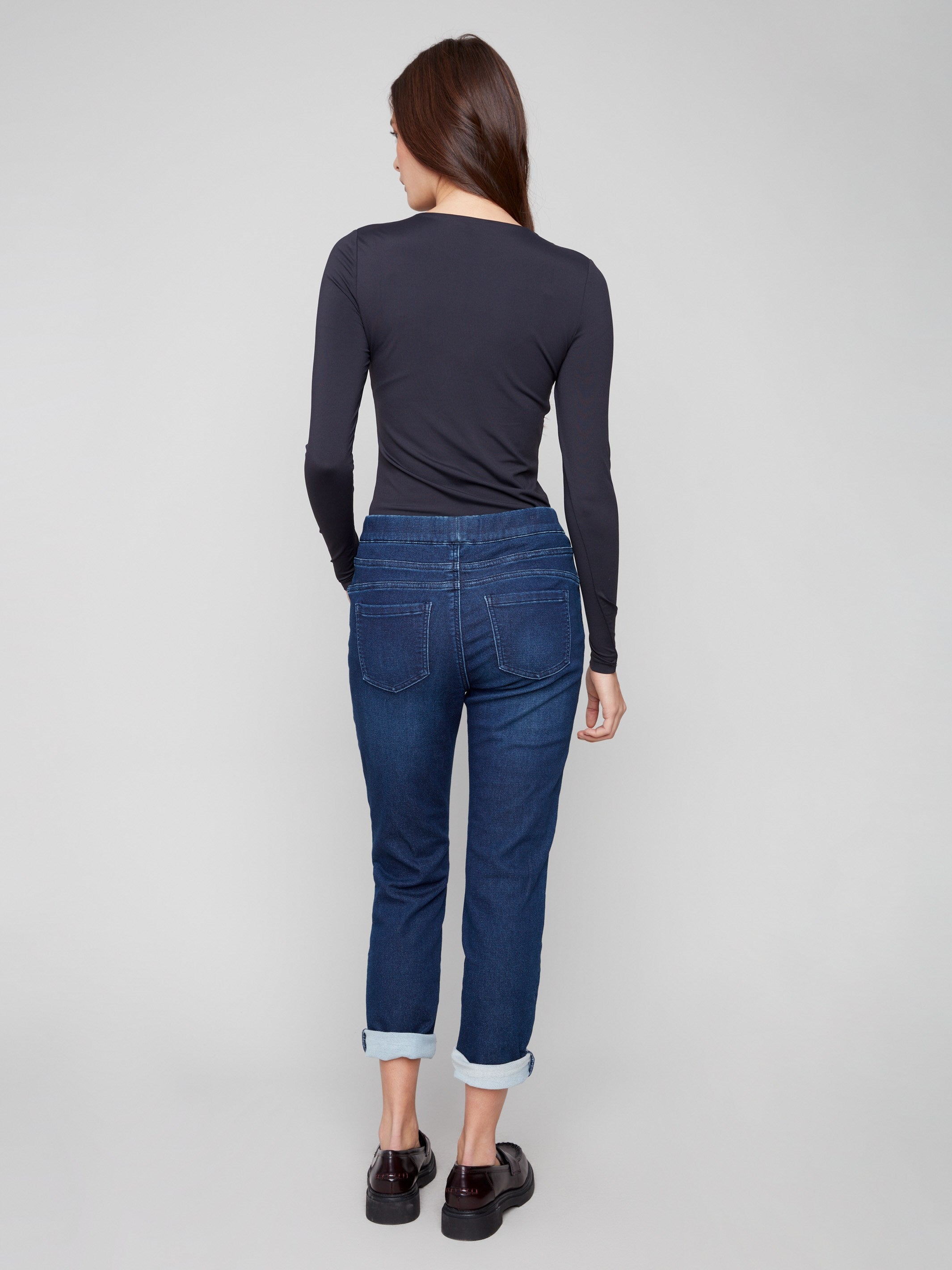 Indigo denim joggers showcasing an elastic waistband with drawstring and sleek rolled cuffs for added flair by Charlie B.