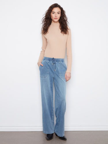These jeans feature a wide leg, offering a relaxed fit for ultimate comfort and style by Charlie B.