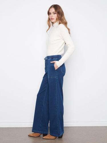Designed with convenient slash pockets, these pants blend functionality with fashion effortlessly. By Charlie B.