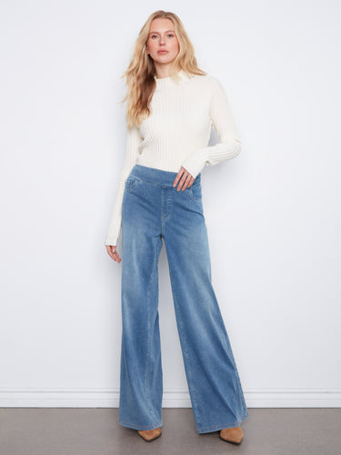 Embrace the timeless appeal of these regular rise wide-leg jeans in medium blue, designed for modern elegance by Charlie B.