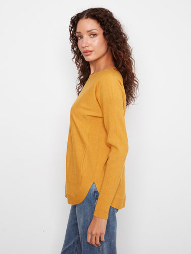 The ourlet arrondi gives this sweater a flattering finish that complements any outfit beautifully by Charlie B.