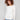 Ecru knit sweater featuring a stylish boat neck design and rounded hem, perfect for casual elegance by Charlie B.