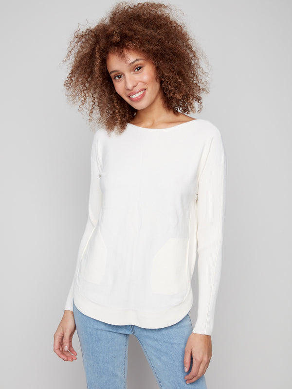 Ecru knit sweater featuring a stylish boat neck design and rounded hem, perfect for casual elegance by Charlie B.