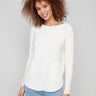 Ecru knit sweater featuring a stylish boat neck design and rounded hem, perfect for casual elegance by Charlie B.