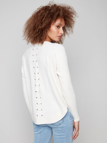 Elegant ecru knit sweater showcasing intricate back lace-up eyelet details for added flair by Charlie B.