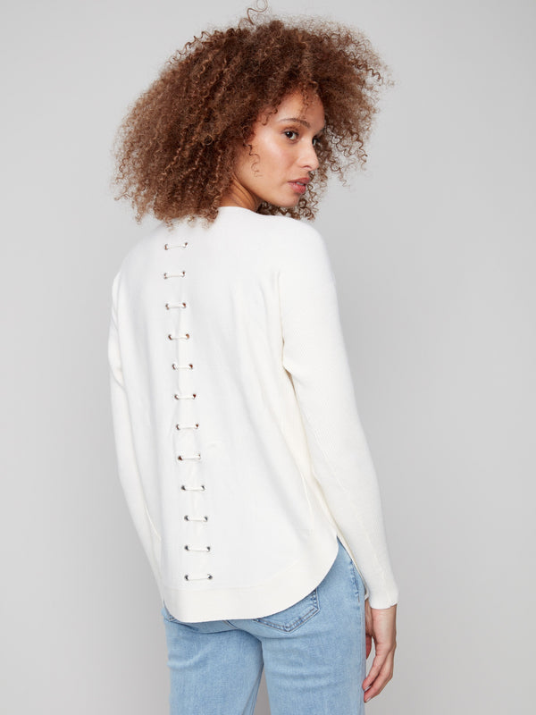 Elegant ecru knit sweater showcasing intricate back lace-up eyelet details for added flair by Charlie B.