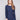 Elegant heather denim sweater featuring a stylish boat neck and ribbed long sleeves, perfect for any occasion by Charlie B.