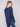 Chic denim knit sweater with unique back lace-up eyelet details, adding a modern twist to your wardrobe by Charlie B.