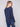 Chic denim knit sweater with unique back lace-up eyelet details, adding a modern twist to your wardrobe by Charlie B.