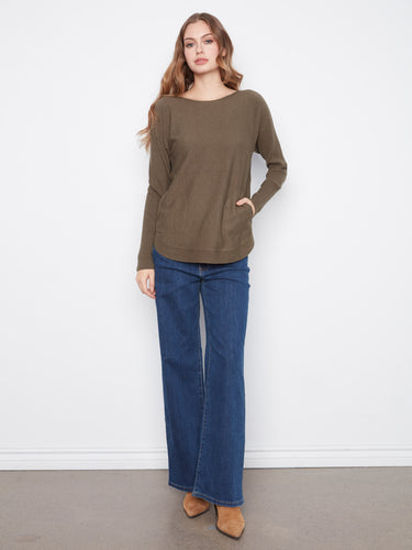 This olive sweater has back lace-up eyelet details, adding a unique twist to its classic look. A stylish choice by Charlie B.