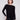 Black knit sweater featuring a stylish boat neck design and elegant front pockets by Charlie B.