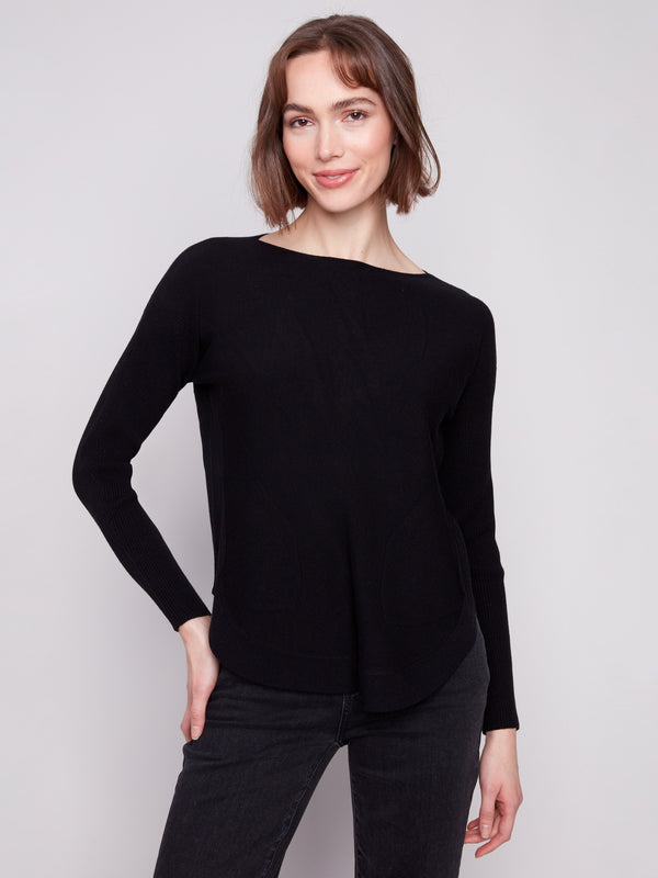 Black knit sweater featuring a stylish boat neck design and elegant front pockets by Charlie B.
