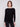 Stylish black knit sweater with a flattering rounded hem that adds a touch of elegance by Charlie B.