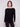 Stylish black knit sweater with a flattering rounded hem that adds a touch of elegance by Charlie B.
