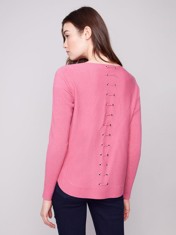 Pink knit sweater showcasing back lace-up eyelet details, adding a unique touch to your wardrobe by Charlie B.
