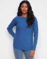 Blue sweater with a stylish boat neck and long ribbed sleeves, perfect for a cozy yet chic look. By Charlie B.
