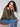 Cozy spruce knit sweater with rounded hem design, ideal for layering during cooler seasons by Charlie B.