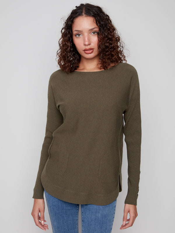 Versatile spruce knit sweater designed with functional side pockets for added practicality by Charlie B.