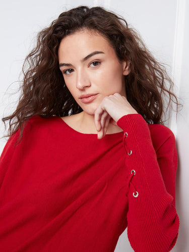 Elegant red sweater with cuff lace-up detail, adding a unique touch to your wardrobe essentials by Charlie B.