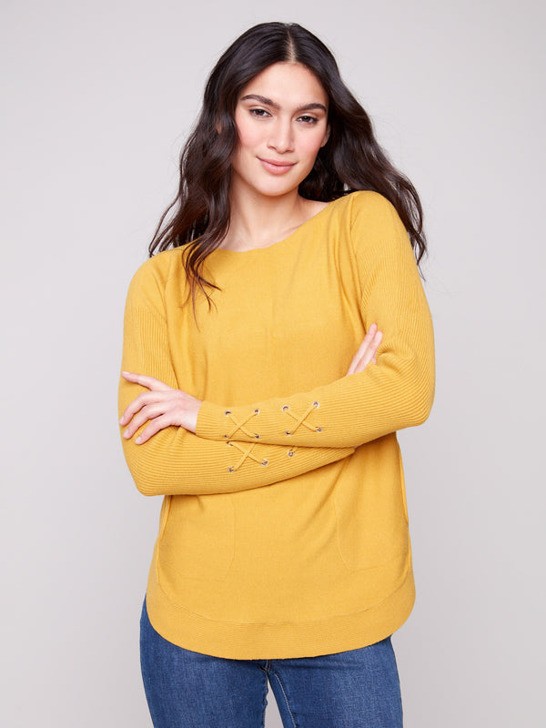 Honey knit sweater featuring a stylish boat neck and elegant design by Charlie B.