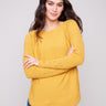 Honey knit sweater featuring a stylish boat neck and elegant design by Charlie B.